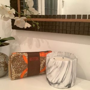 Our statement leather and African fabric clutch handbags in 2 styles. 1