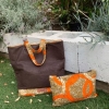 Our statement leather and African fabric clutch handbags in 2 styles. 9