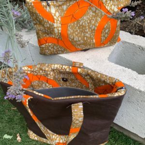 Our statement leather and African fabric clutch handbags in 2 styles.