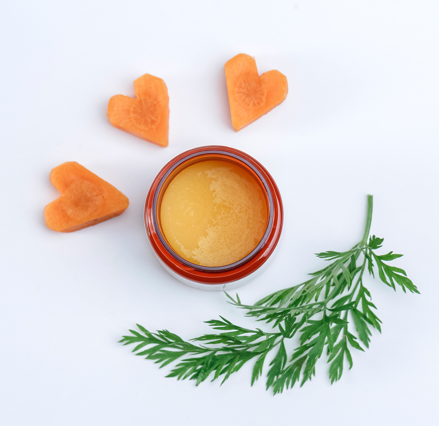 Incredible Carrot Hero Balm with carrot hearts and green tops
